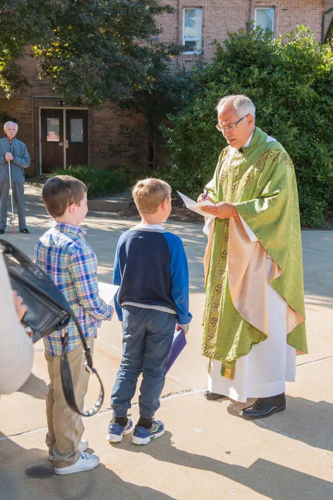Father Hahn with parishioners